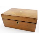 An early 20thC walnut writing box, with brass shield and lock plates, opening to reveal two inkwells