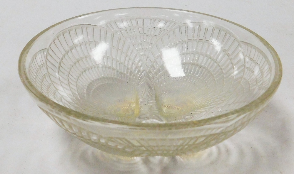 A Lalique Coquilles pattern glass bowl, shaped with four shells on feet in outer decoration, signed