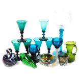 A group of coloured glassware, to include a set of seven late 19thC green glass wine glasses, a gree