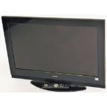 A Hitachi 31" flat screen television, model V90513932, with power lead and remote.