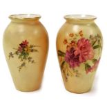 A pair of Royal Worcester blush ivory bud vases, each florally decorated, with sprays of pink and pu