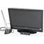 A Hitachi 25.5" flat screen television, serial number V90205988, with power lead, remote control and