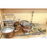 A group of brass and copperwares, to include two copper kettles, copper trivet, brass table lamp,