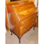 A late 19thC walnut bureau, with fall down flap opening to reveal leather inset top, above three