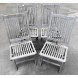 Four garden slat back chairs.