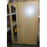 A beech effect triple wardrobe, with single mirror door and two additional doors, 191cm high,