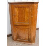 A painted mahogany effect corner cabinet.