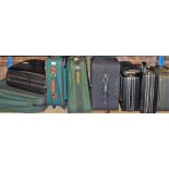 Various suitcases, material cases, ties, and two Potterton cases. (9)