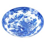 An 18thC Worcester porcelain saucer dish, printed in blue with oriental scenes of buildings,