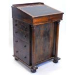 A Victorian rosewood Davenport, the hinged top with a leather insert enclosing a birds eye maple