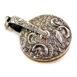 A Victorian silver pin wheel, repousse decorated with bird, flowers, scrolls, etc., by S Mordan