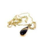 A 9ct gold Blue John set pendant and chain, the teardrop shape Blue John pendant in a rub over 9ct