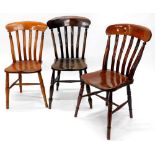 Three Windsor type kitchen chairs, each with lathe back, a solid seat on turned legs with H
