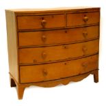 A 19thC pine bow fronted chest of drawers, with a plain top above two short and three long