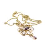 An Art Nouveau pendant and chain, the Art Nouveau pendant set with central amethyst and seed pearls,