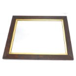 A plain oak wall mirror, with a parcel gilt border, 70cm x 64cm.