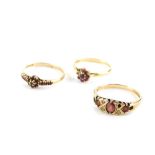 Three gold and red stone dress rings, two set in 9ct gold, 4.4g all in, and one set in 18ct gold,