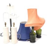 A collection of table lamps, to include a pair of pottery examples, made to simulate bamboo, etc. (