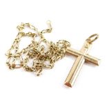 A yellow metal cross pendant, stamped 375, and a 9ct gold fine chain, 4.4g all in.