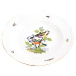 A Meissen porcelain soup plate, later decorated with birds on a branch, insects, etc., cross