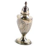 A Victorian urn shaped pepper pot, with part reeded decoration, cast with flowers, scrolls, etc.,