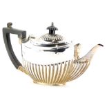 A Victorian silver teapot, with part reeded decoration, and ebonised knop and angular handle,