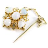 A Victorian opal and diamond brooch, with central over cut opal in claw setting, surrounded by