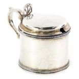 A Victorian Scottish silver mustard pot, with bead border decoration, lacking blue glass liner,