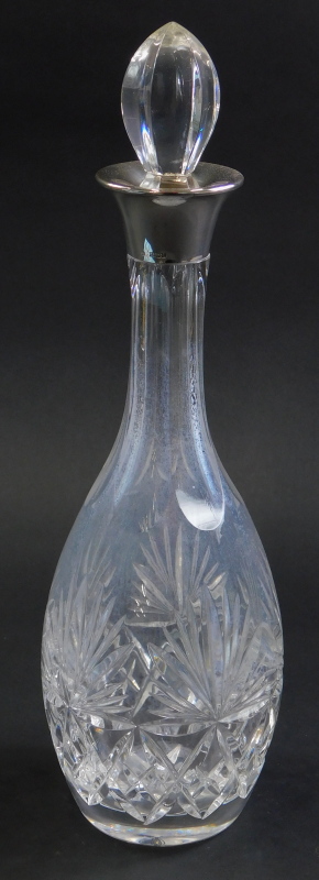 An Elizabeth II cut glass decanter, with silver collar, Birmingham 1979, 36cm high.