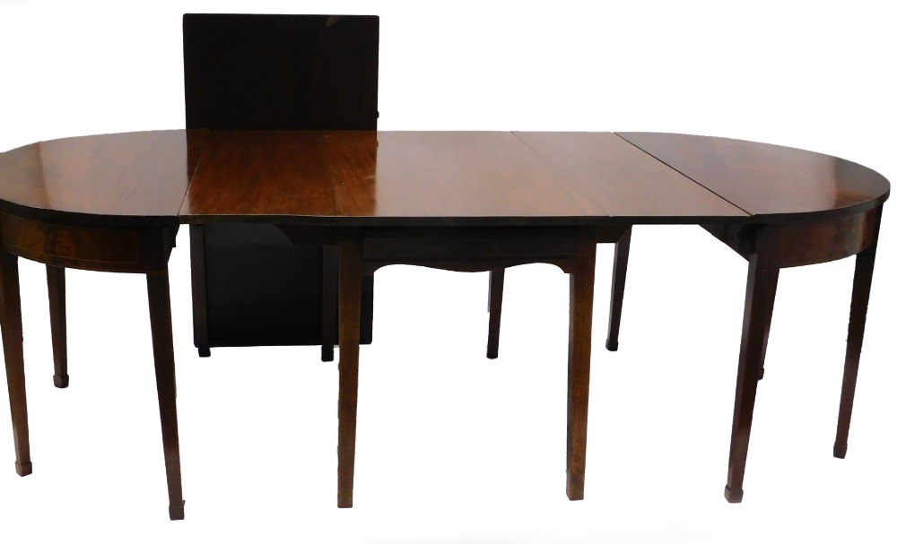 A mahogany D end dining table, with boxwood and ebony stringing, comprising two D ends each with