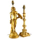 A gilt plaster table lamp base, decorated in the form of a young cherub holding a shield with quiver