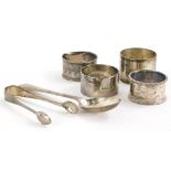 A collection of small silver, to include sugar tongs, napkin rings, 4cm diameter, spoon, etc., 4½