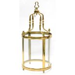 A large brass lantern, with four curved glass panels, 120cm high, 54cm diameter.