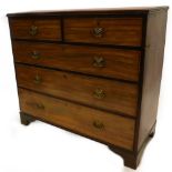 An early 19thC mahogany chest of drawers, the top with a moulded edge above two short and three long