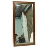 An oak rectangular wall mirror, with a beaded border, 162cm x 83cm.