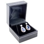 A pair of sapphire and diamond teardrop earrings, with central teardrop cut, pale blue sapphire,