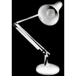 A white painted Anglepoise type adjustable desk lamp.