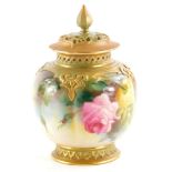 A Royal Worcester porcelain pot pourri jar and cover, the pierced lid with a shaped finial, the base