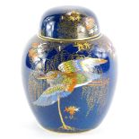 A Carltonware blue glazed ginger jar, decorated in gilt and raised enamels with willow tree,