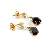 A pair of costume jewellery drop earrings, each set with red imitation garnet stone and various