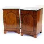 A pair of 19thC figured mahogany pedestals, each with a raised panelled door on bracket feet, 73cm