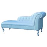 A cream leatherette upholstered chaise lounge, with button back and arm, on cabriole legs, 156cm