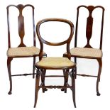 A pair of Edwardian mahogany and boxwood strung bedroom chairs, each on cabriole legs and a