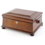 A Victorian rosewood sarcophagus shaped workbox, the hinged lid enclosing a interior with later