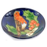 A Moorcroft pottery pin tray, decorated with a robin, holly and berries, impressed marks to