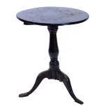 A 19thC oak occasional table, the circular tilt top on a turned column and tripod base with pad