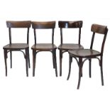 A set of four bentwood chairs, each with a shaped back solid seat with splayed legs.