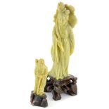 A green Chinese soapstone figure of a lady, possibly Guan Yin, 21cm high, and another figure, (2).