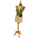 A dressmaker's dummy, on a turned wooden stand with tripod stamped Stockman Paris, 159cm high.