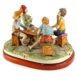 A Capodimonte porcelain group The Cheat, indistinctly signed and numbered 330, on a wooden base,